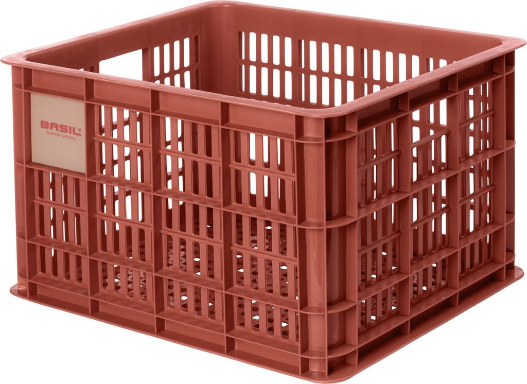 A close-up, studio shot of a red plastic crate.