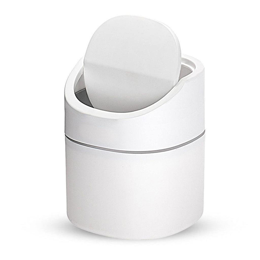 A white trash can with a lid.