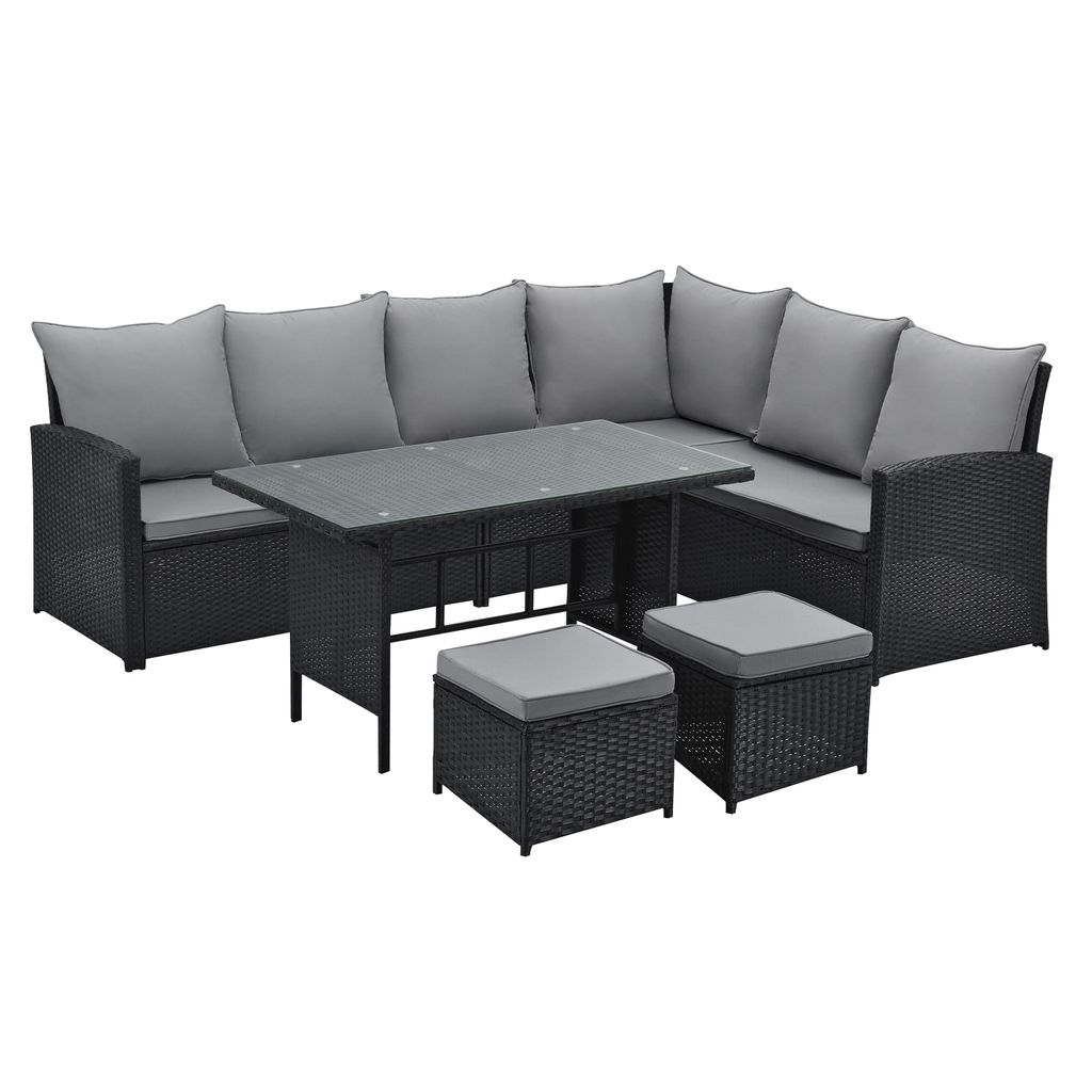 A black rattan garden lounge set with gray cushions and a glass-topped table, shown on a white background.