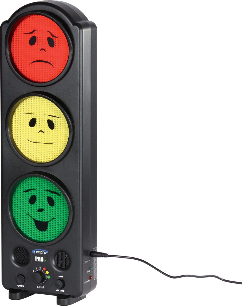 A traffic light-shaped device with smiley faces on red, yellow, and green lights, connected by a cable.