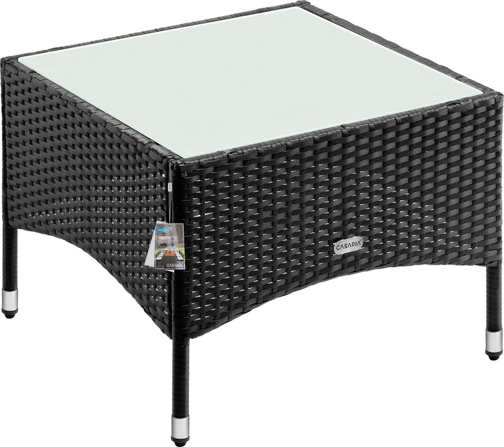 A black polyrattan garden side table with a glass top, shown from a diagonal angle on a white background.