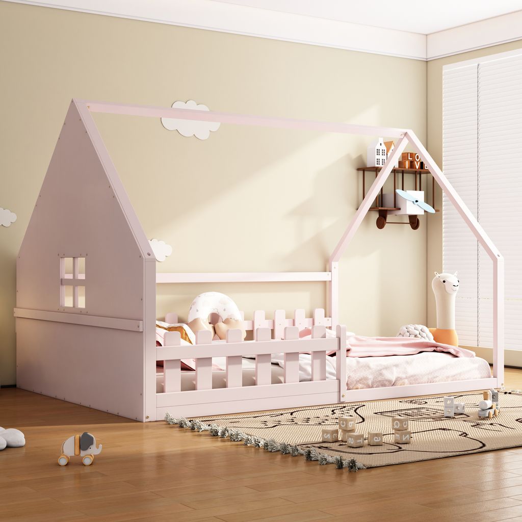 A child's bedroom with a pink house-shaped bed.