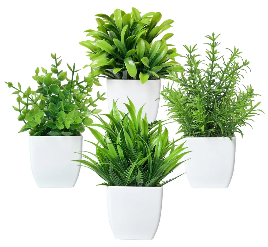 Petites plantes artificielles réalistes avec pots blancs modernes
