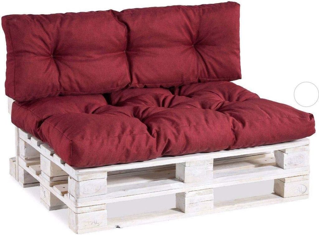 A burgundy pallet sofa cushion set on a white wooden pallet.