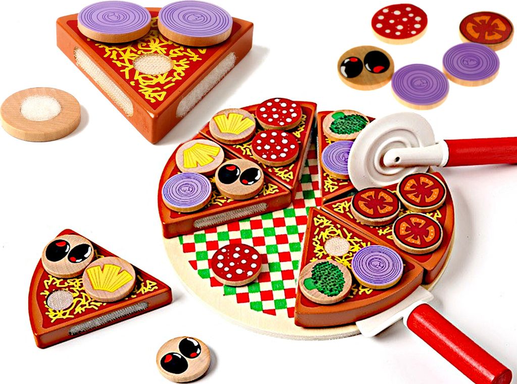 A wooden toy pizza set with various toppings is arranged on a white background.