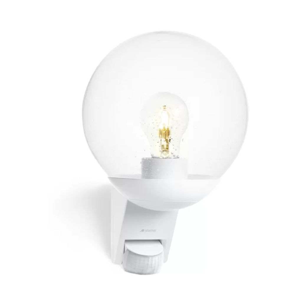 A white outdoor sensor light with a clear globe and a visible bulb.