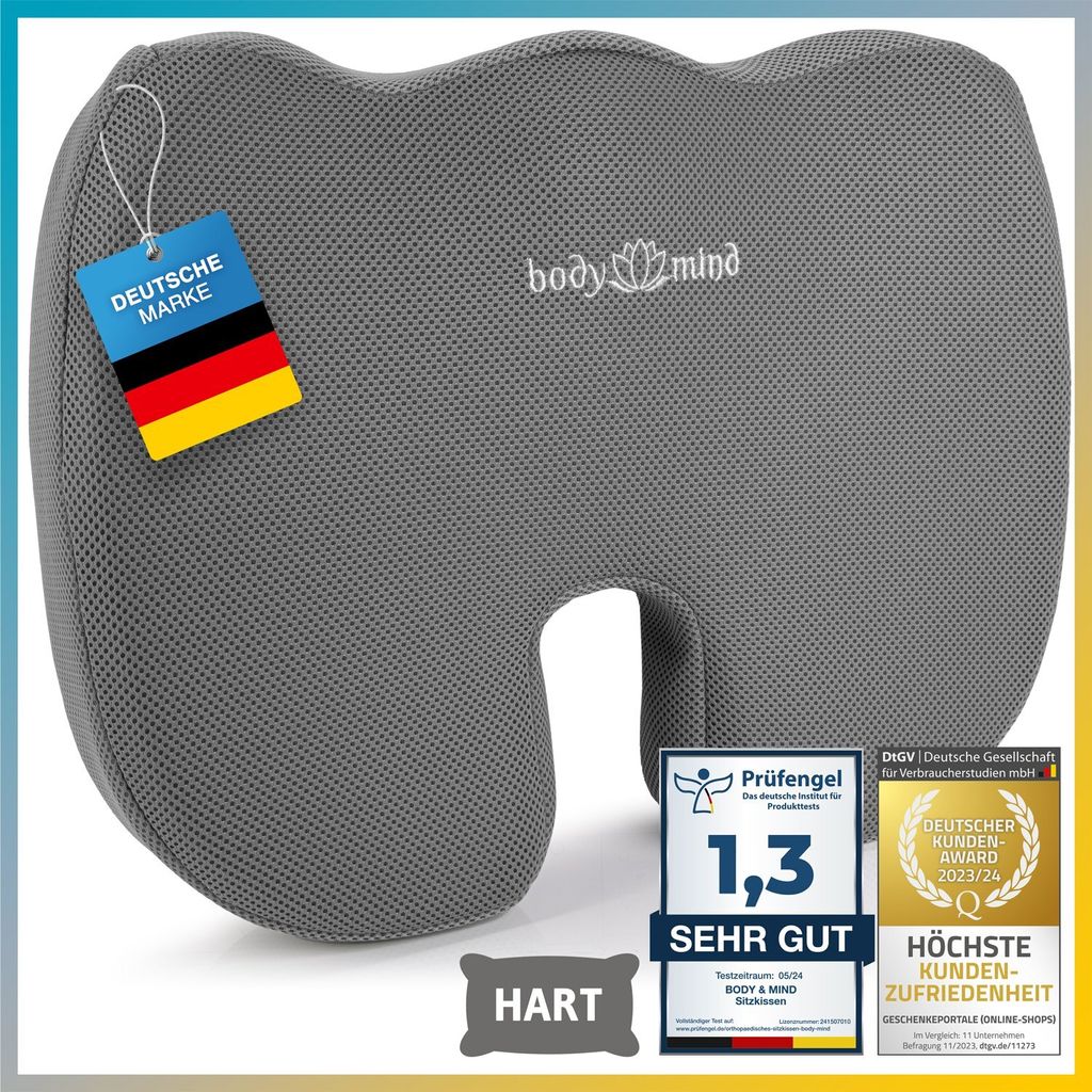A gray orthopedic seat cushion with various certification badges and a German flag tag.