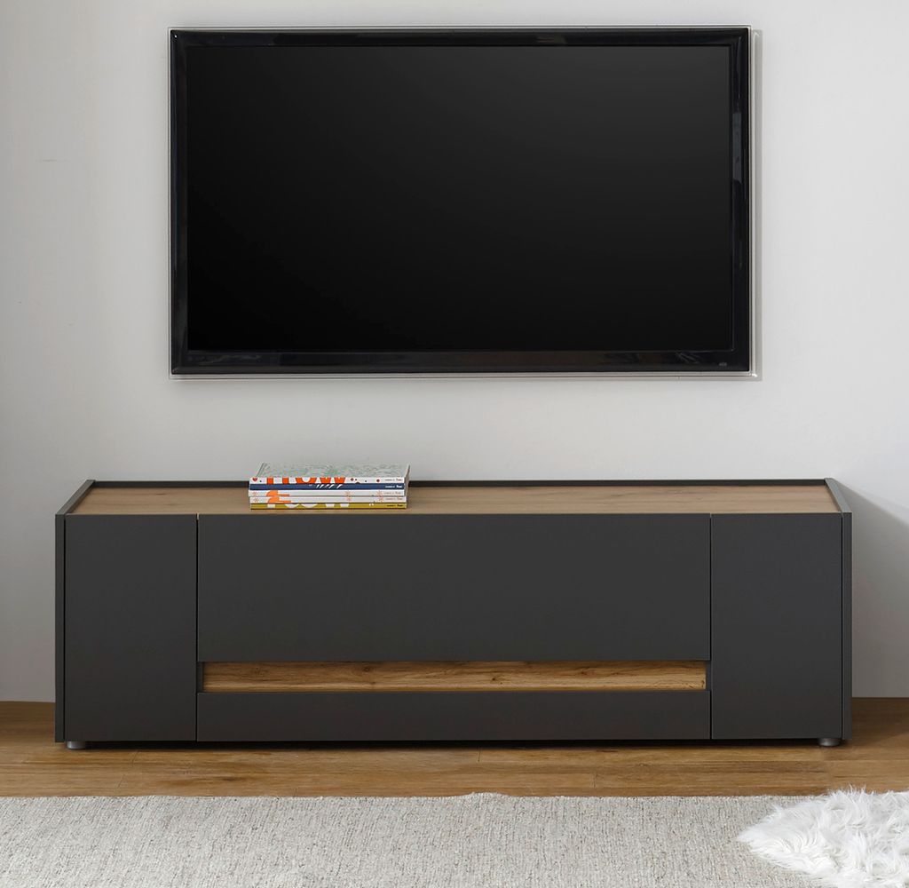 A modern TV stand with a television mounted above it.
