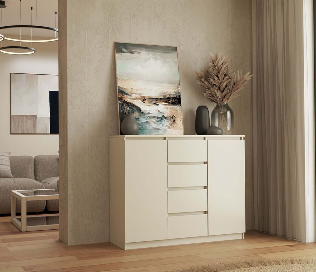 A modern living room with a beige sideboard and artwork.
