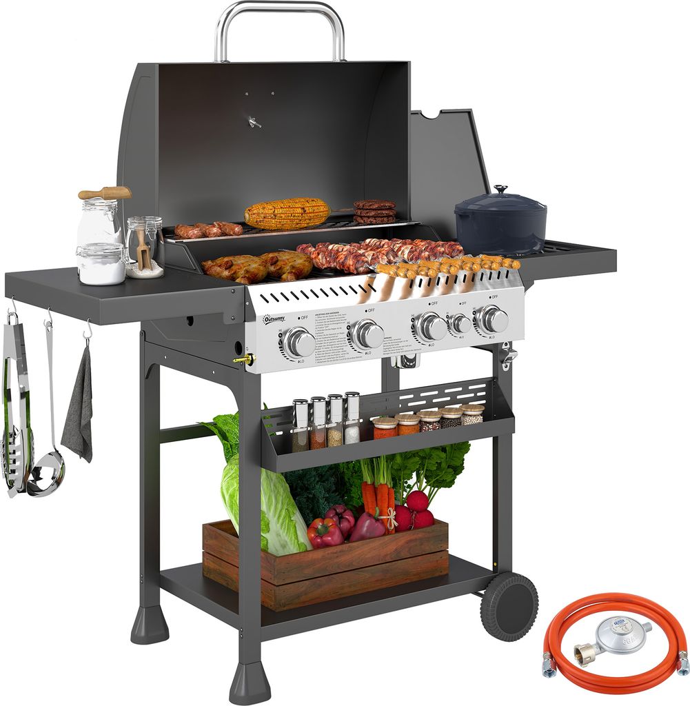A gas grill with food and vegetables displayed.