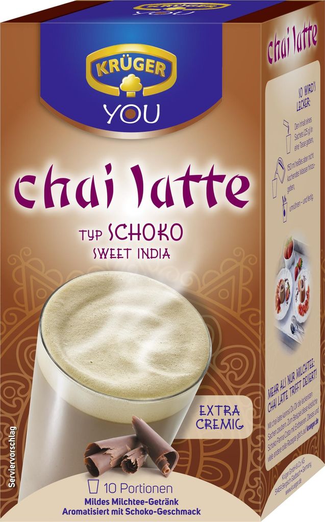 A box of Krüger You Chai Latte, with a glass of the beverage and chocolate shavings shown.