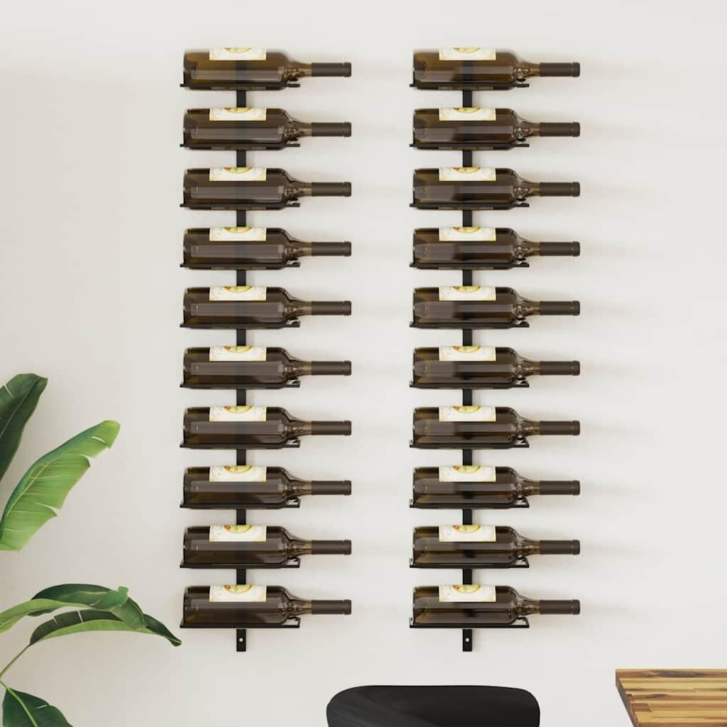 Two black metal wine racks mounted on a white wall, each holding multiple wine bottles.