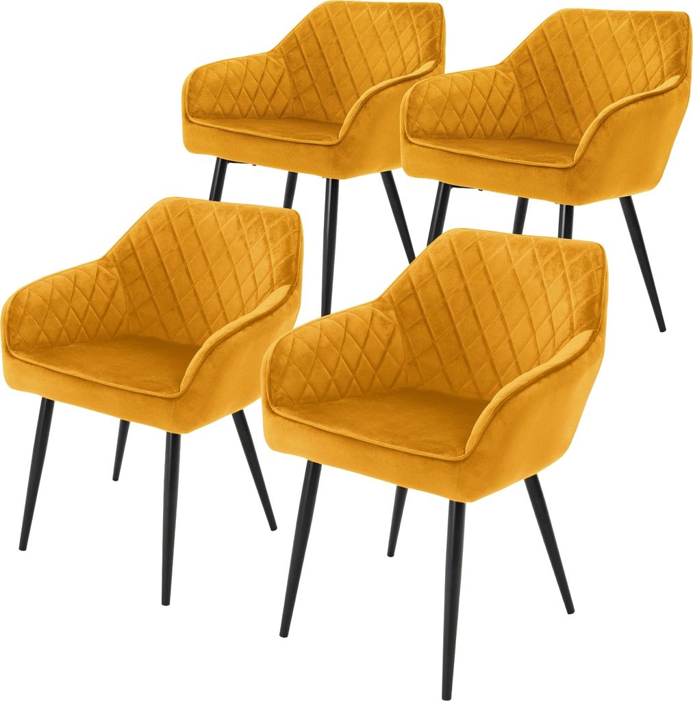 Four mustard yellow dining chairs with black legs are arranged in a staggered formation against a white background.