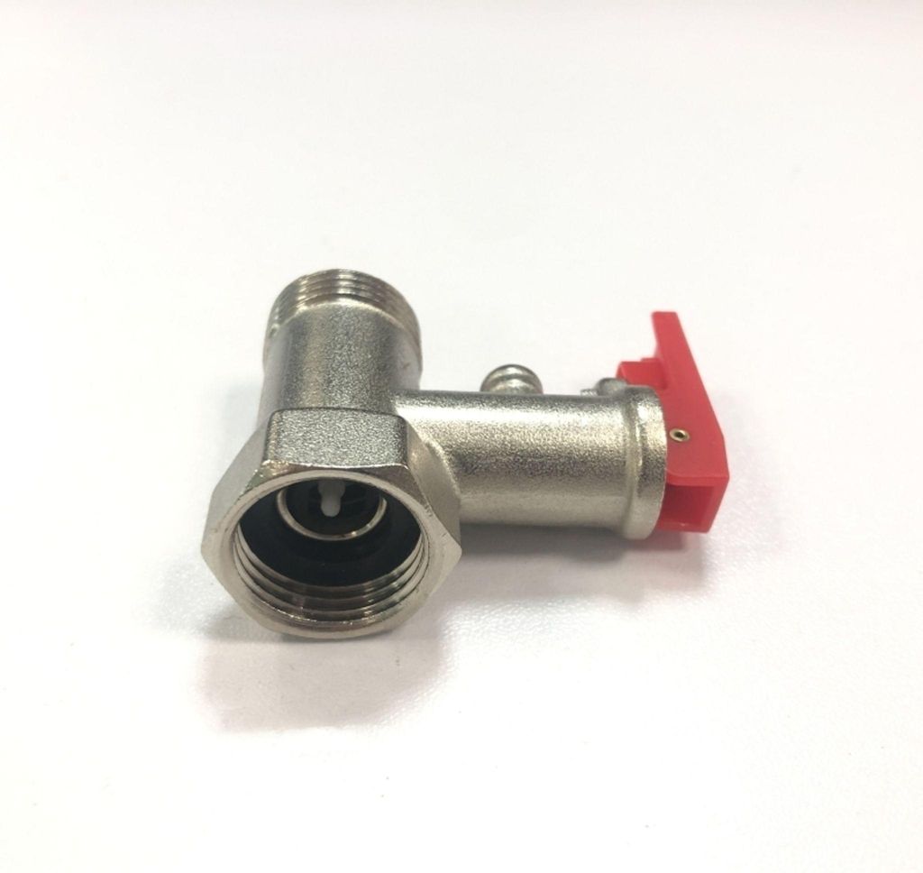 A close-up studio shot of a brass pressure relief valve with a red lever, set against a plain white background.