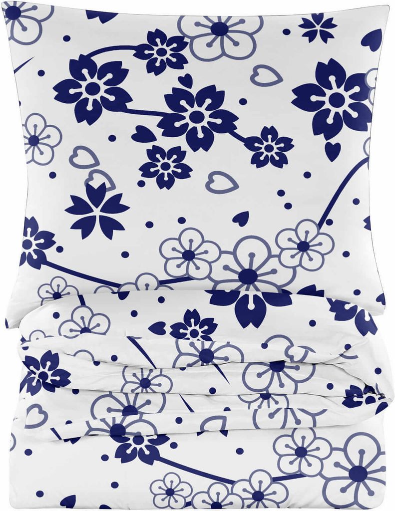 A stack of folded bedding with a floral pattern.