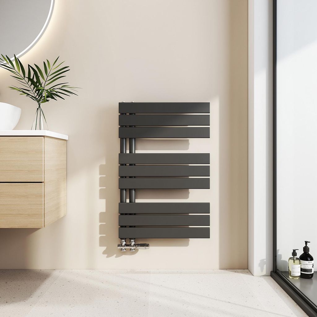 A modern bathroom with a wooden vanity, a sink, and a dark gray towel radiator.
