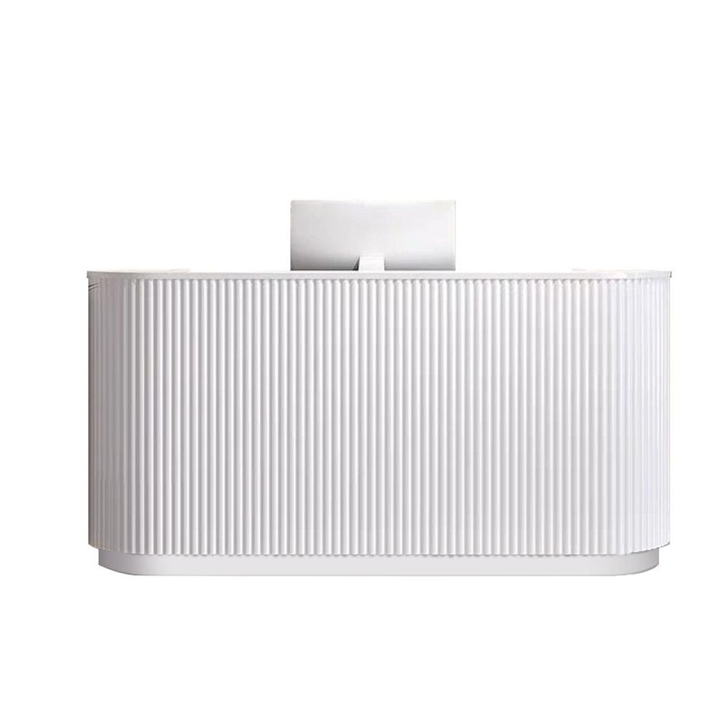 A white reception desk with a computer monitor on top, set against a white background.