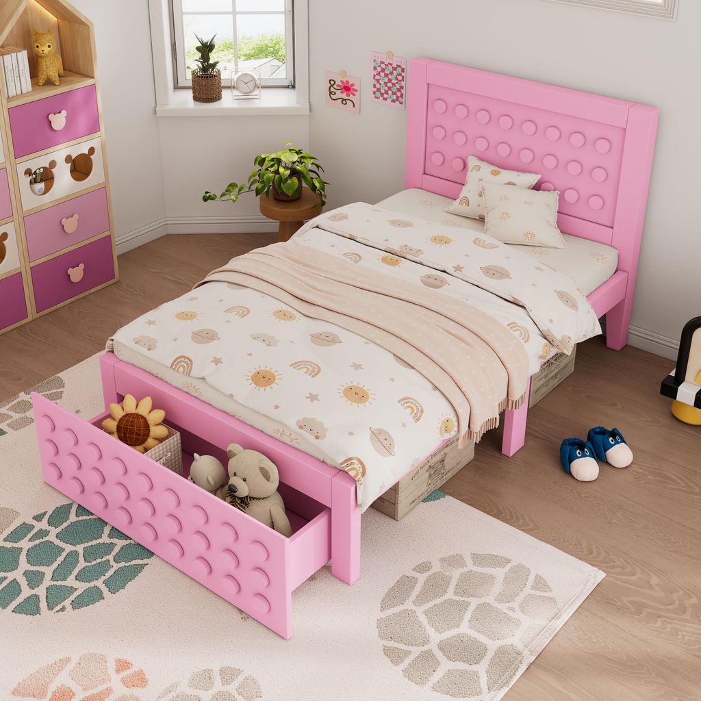 A child's bedroom with a pink bed, dresser, and rug.