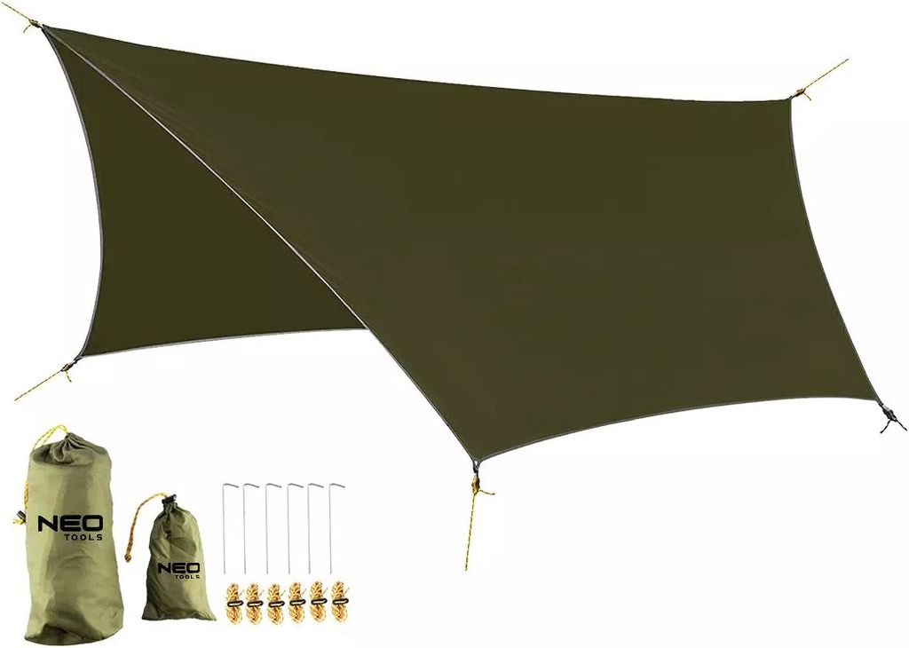 A green tarp is spread out, with accessories like bags and stakes laid out beside it.