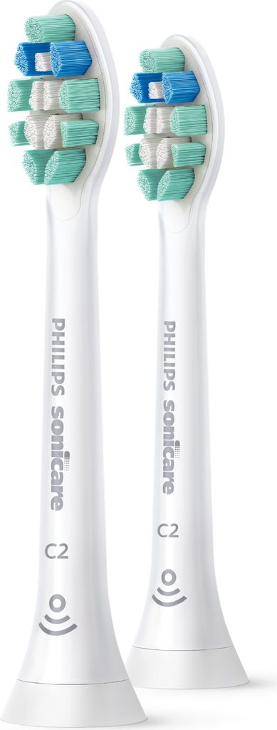 Two white toothbrush heads with green and blue bristles are shown against a white background.