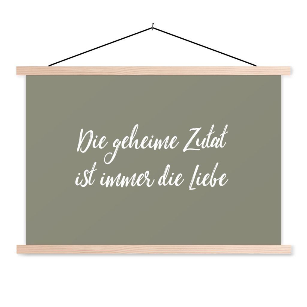 MuchoWow Textilposter Sprichwörter - Zitate - Die geheime Zutat ist immer die Liebe - Liebe 120x80 cm mit holzfarbenen Rahmen - Aufhängeset