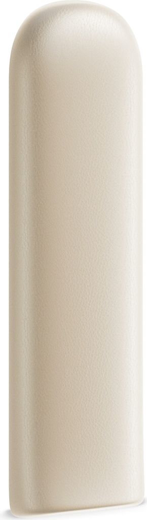 A single, cream-colored object with a rounded top and a flat base.