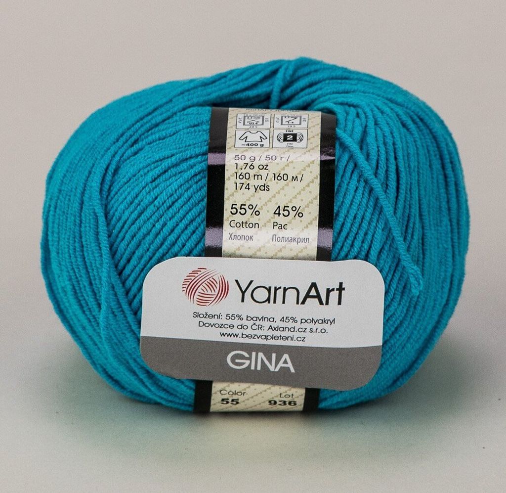 A ball of turquoise yarn with a label.