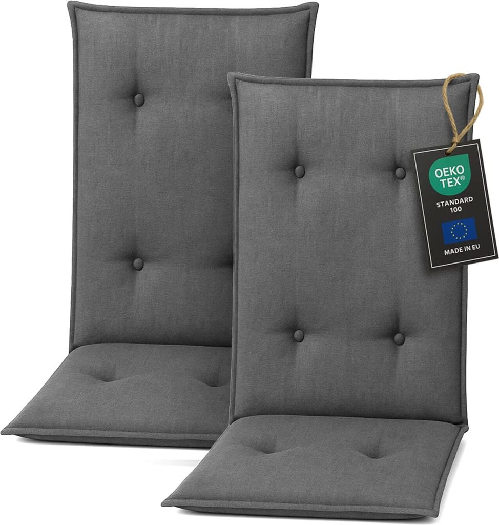 Two dark gray chair cushions are shown against a white background. One cushion has a tag attached.