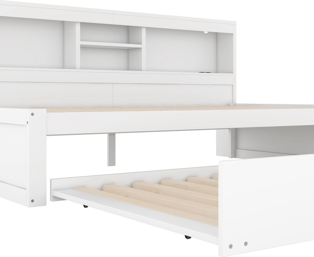 A white daybed with a pull-out trundle bed and storage compartments in the headboard.
