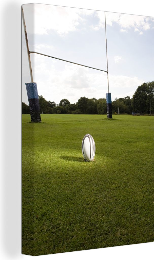 OneMillionCanvasses - Leinwandbilder - 90x140 cm, Ein beleuchteter Rugbyball auf einem Rasenplatz, Wandbilder Kunstdruck Wanddekoration - Wandsch...