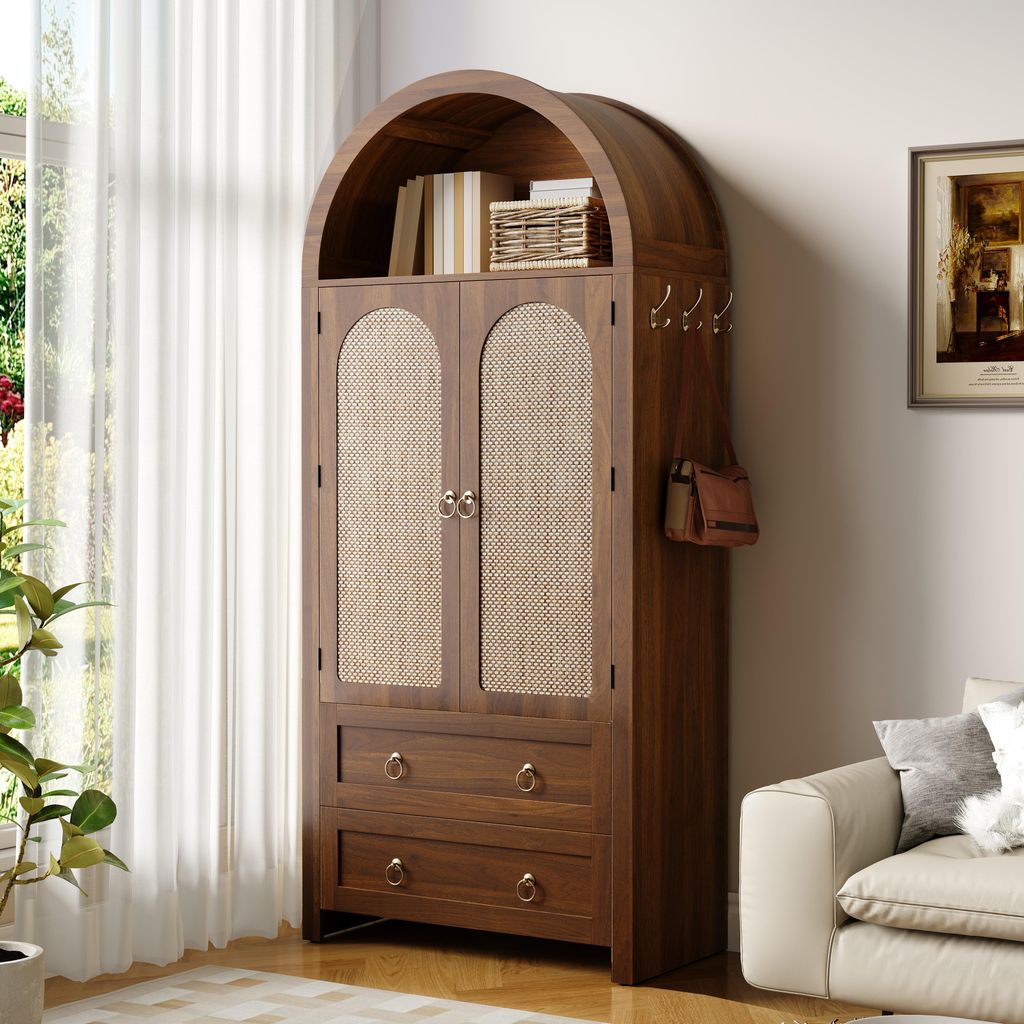 A wooden cabinet with woven doors and drawers, placed in a room next to a window and a sofa.