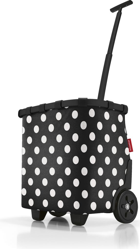 A black and white polka dot shopping trolley with a telescopic handle and wheels.