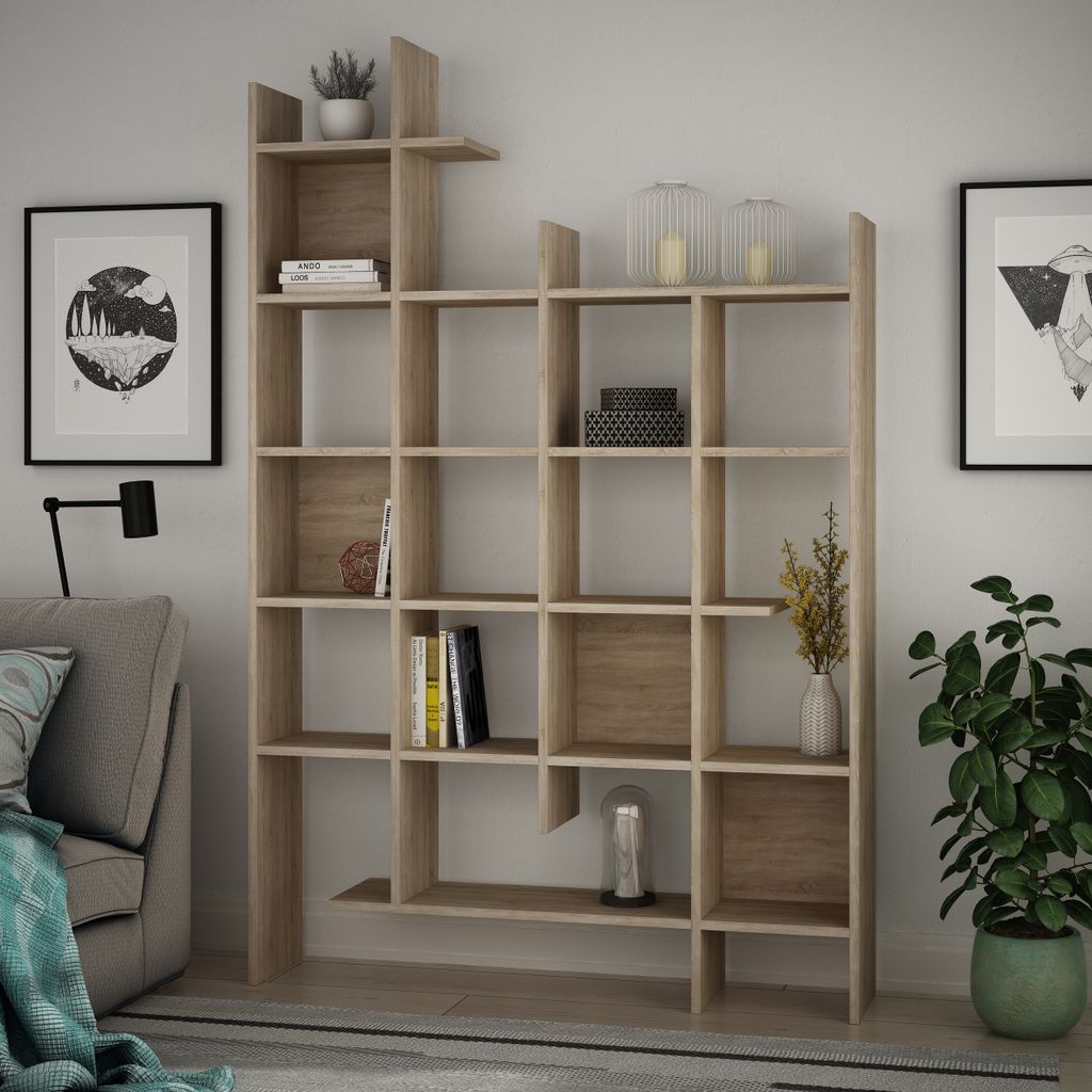 A modern living room with a wooden bookshelf filled with books and decorative items.
