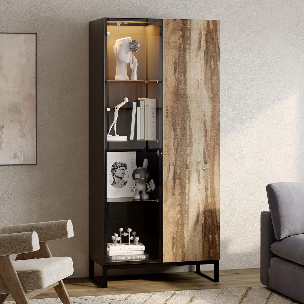 A tall display cabinet with a glass door and a wooden door, showcasing decorative items and books, in a living room setting.