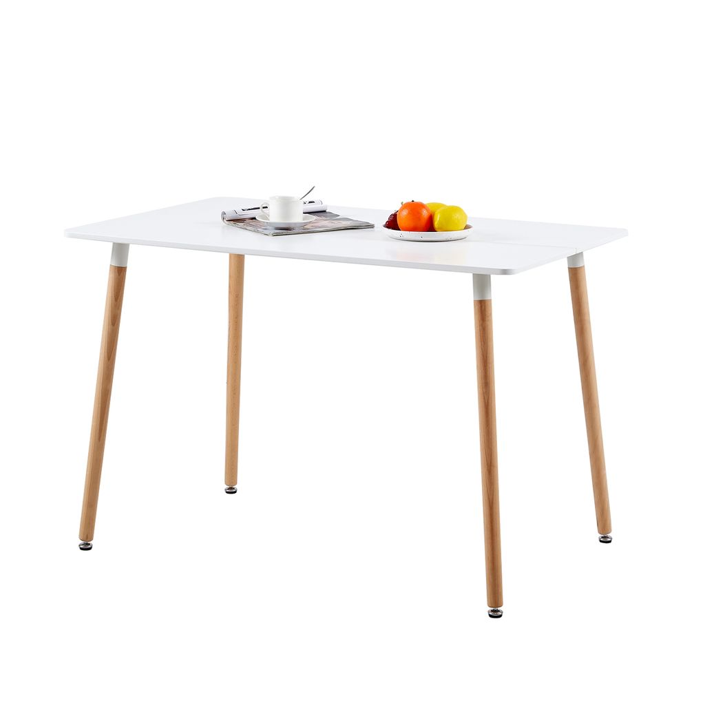 A white rectangular dining table with four wooden legs, set against a white background. A small plate with fruit and a cup of coffee are on the table.