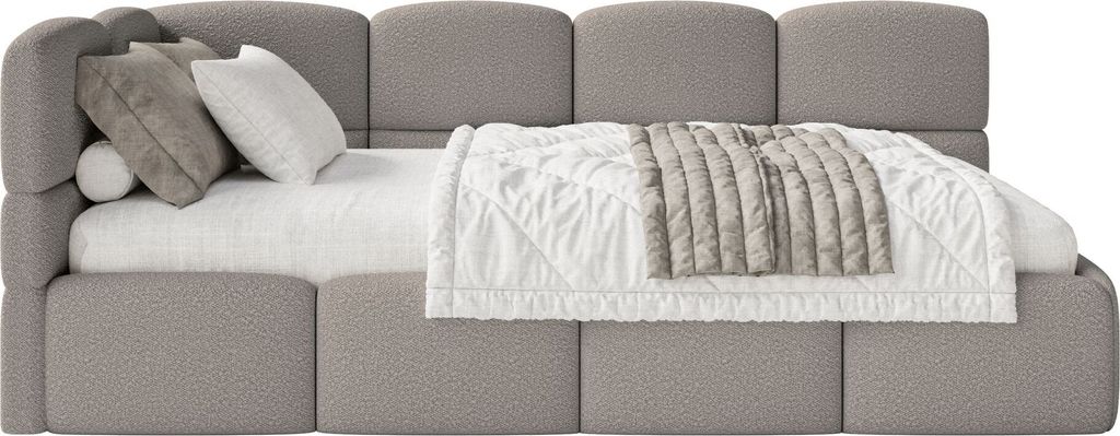 A bed with pillows and a blanket.