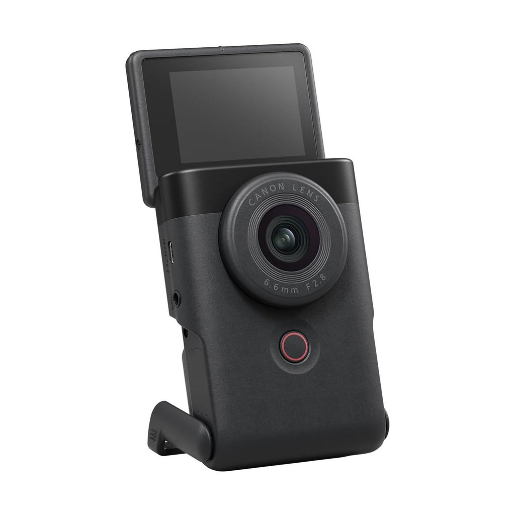 A black compact camera with its screen flipped up, shown against a white background.