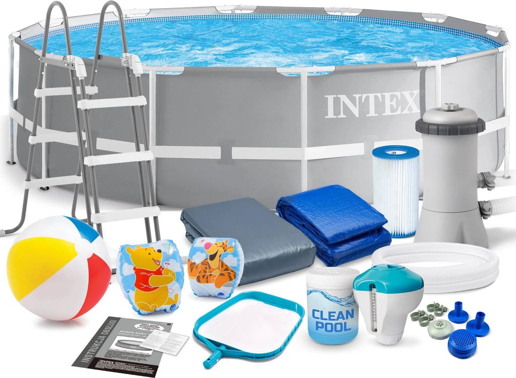 A collection of pool accessories and pool cleaning supplies laid out in front of an above-ground swimming pool.