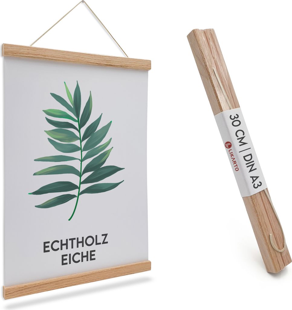 A poster with a green leaf design and wooden frame, next to a rolled-up wooden poster hanger.