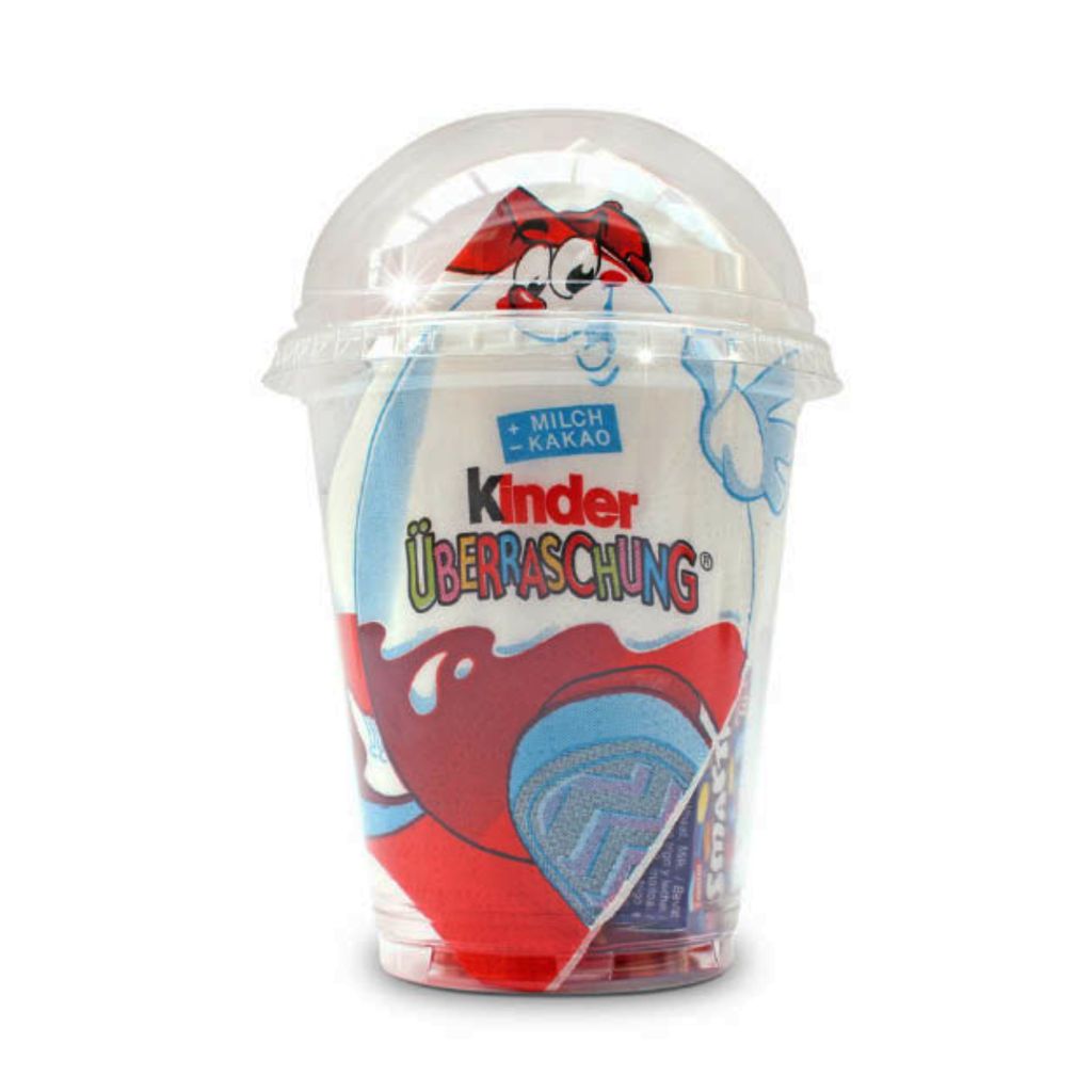 A Kinder Surprise egg in a clear plastic cup with a domed lid.