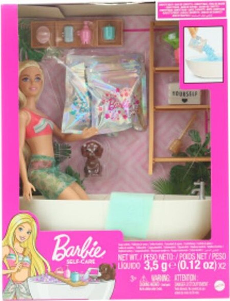 A Barbie doll in a bathtub playset, with accessories and packaging.