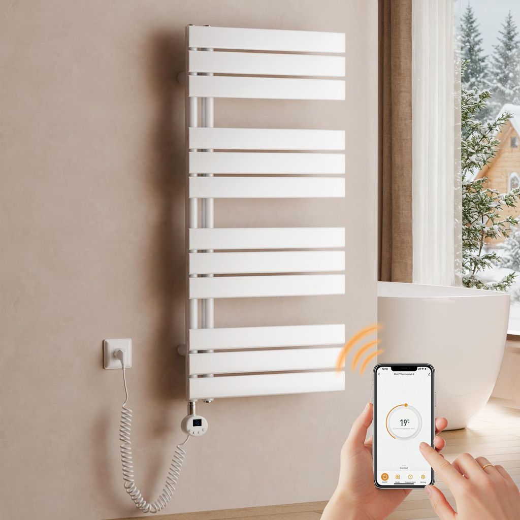 A modern bathroom with a white towel warmer, a bathtub, and a window showing a snowy landscape. A hand is holding a smartphone displaying a temperature control app.