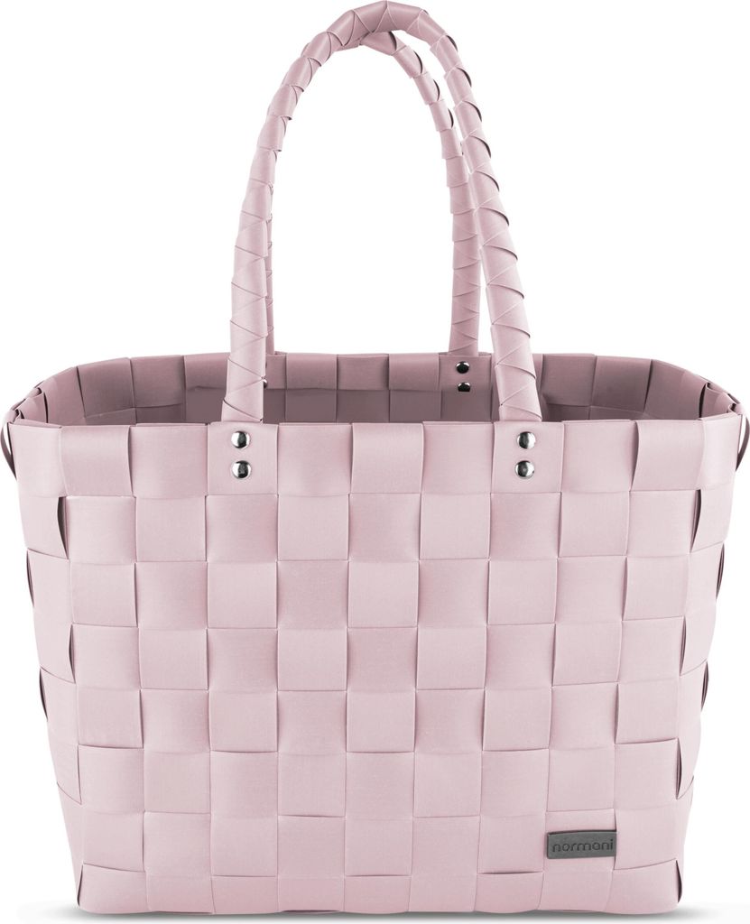 A pink woven basket bag with braided handles, shown against a white background.
