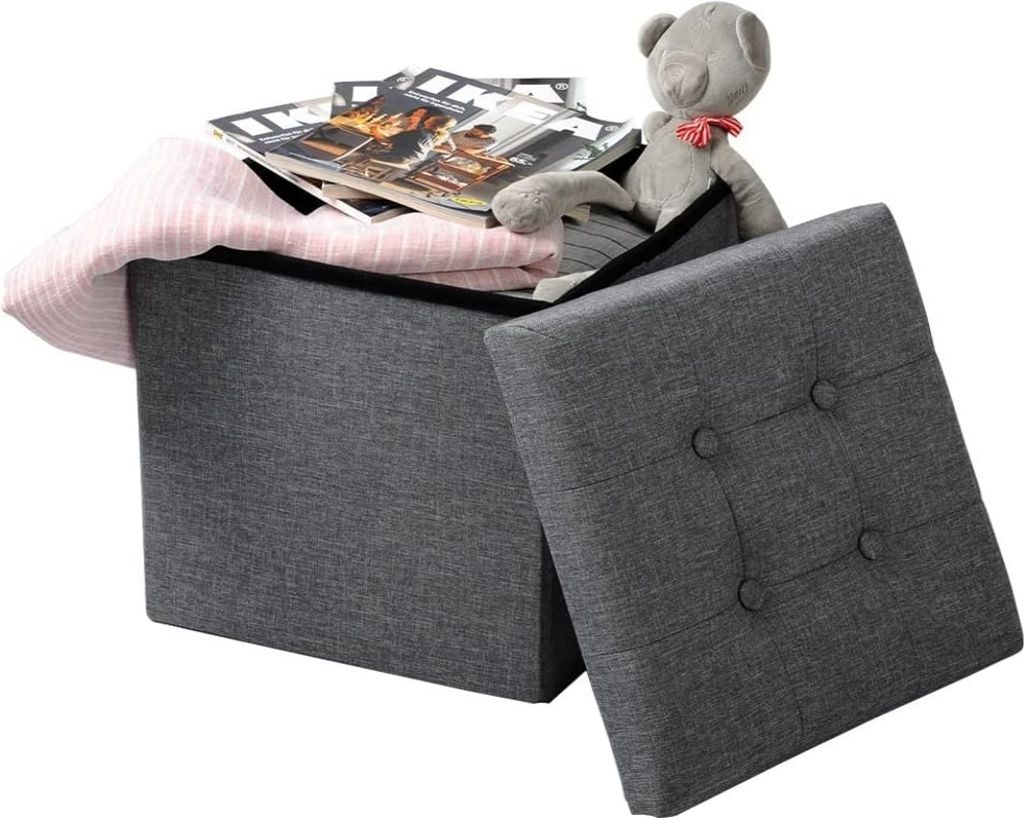 A storage ottoman with its lid open, revealing contents inside.
