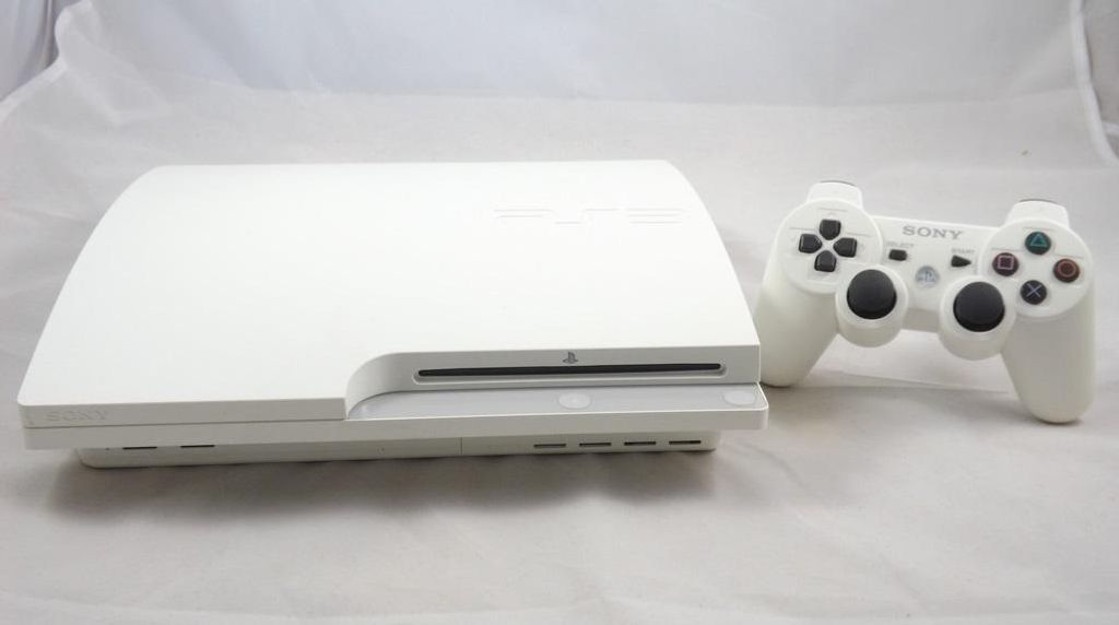 A white PlayStation 3 Slim console and a white controller are displayed on a white background.