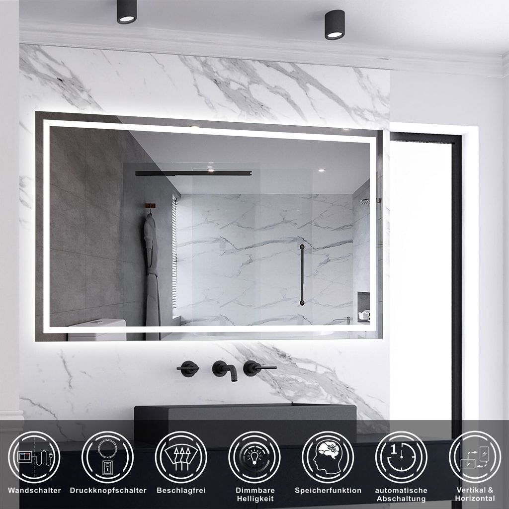 A modern bathroom with a large LED mirror above a sink.