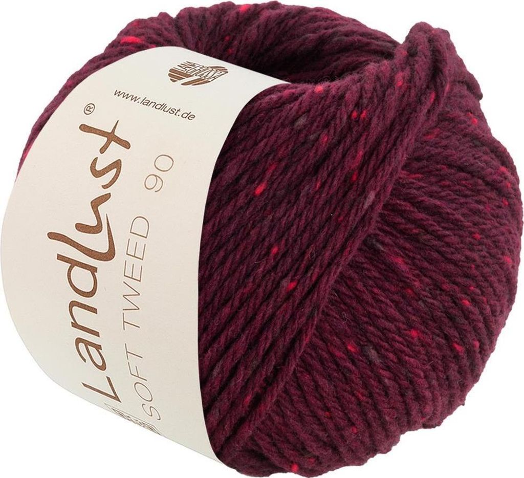 A ball of burgundy tweed yarn with red and gray flecks, with a label wrapped around it.