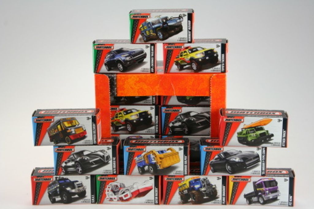 A pyramid-like arrangement of toy car boxes.