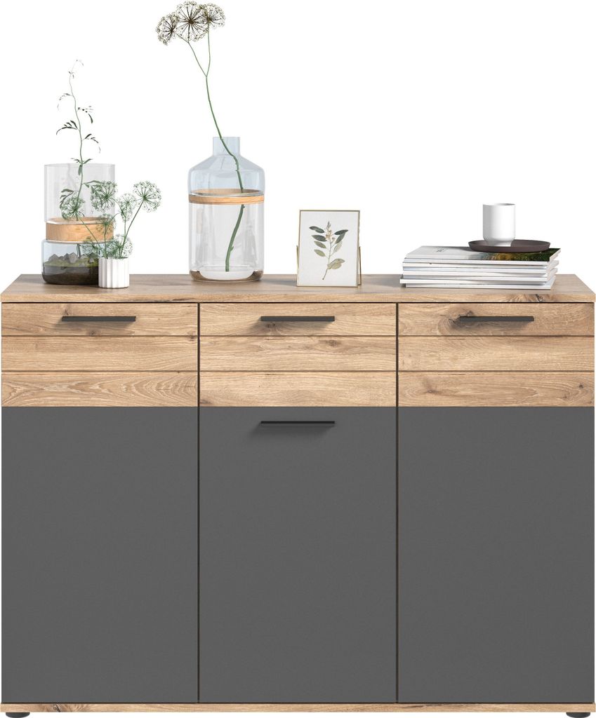 A modern sideboard with wooden top drawers and gray cabinet doors, decorated with vases of flowers and a framed picture.
