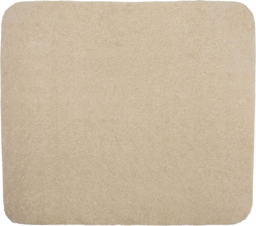 A flat lay of a beige fabric item with rounded corners.